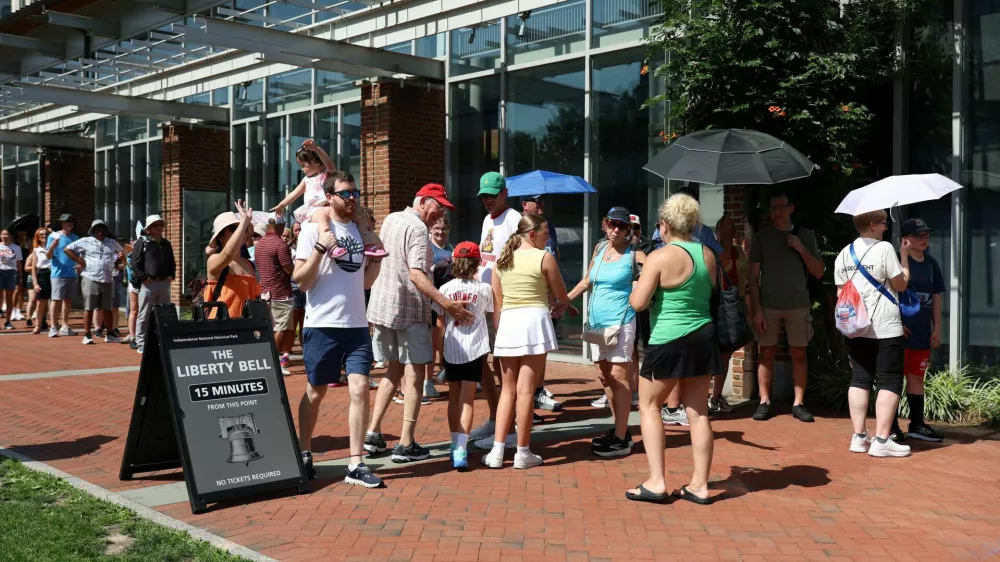People wait in line to view the Liberty Bell at Independence National Historical Park amid a heatwave in Philadelphia, Pennsylvania, U.S., July 2, 2026. REUTERS/Hannah Beier