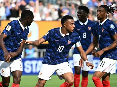 Soccer Football - FIFA World Cup 2026 - Round of 32 - France v Sweden - New York New Jersey Stadium, East Rutherford, New Jersey, U.S. - June 30, 2026 France's Kylian Mbappe celebrates scoring their first goal with Ousmane Dembele and Michael Olise REUTERS/Dylan Martinez