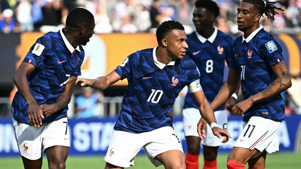 Soccer Football - FIFA World Cup 2026 - Round of 32 - France v Sweden - New York New Jersey Stadium, East Rutherford, New Jersey, U.S. - June 30, 2026 France's Kylian Mbappe celebrates scoring their first goal with Ousmane Dembele and Michael Olise REUTERS/Dylan Martinez