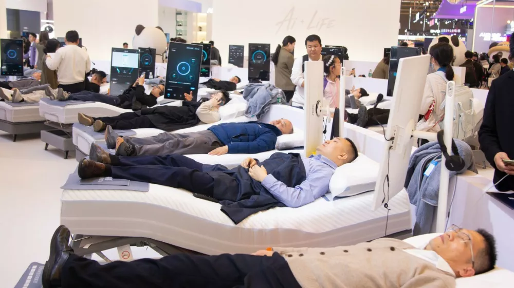 Fairgoers visit the Shufude AI sleeping mattress booth during the second day of the AWE 2026 trade fair at SNIEC in Shanghai, China, on March 13, 2026.AWE 2026 Trade Fair In Shanghai, China - 13 Mar 2026,Image: 1082656071, License: Rights-managed, Restrictions:, Model Release: no 