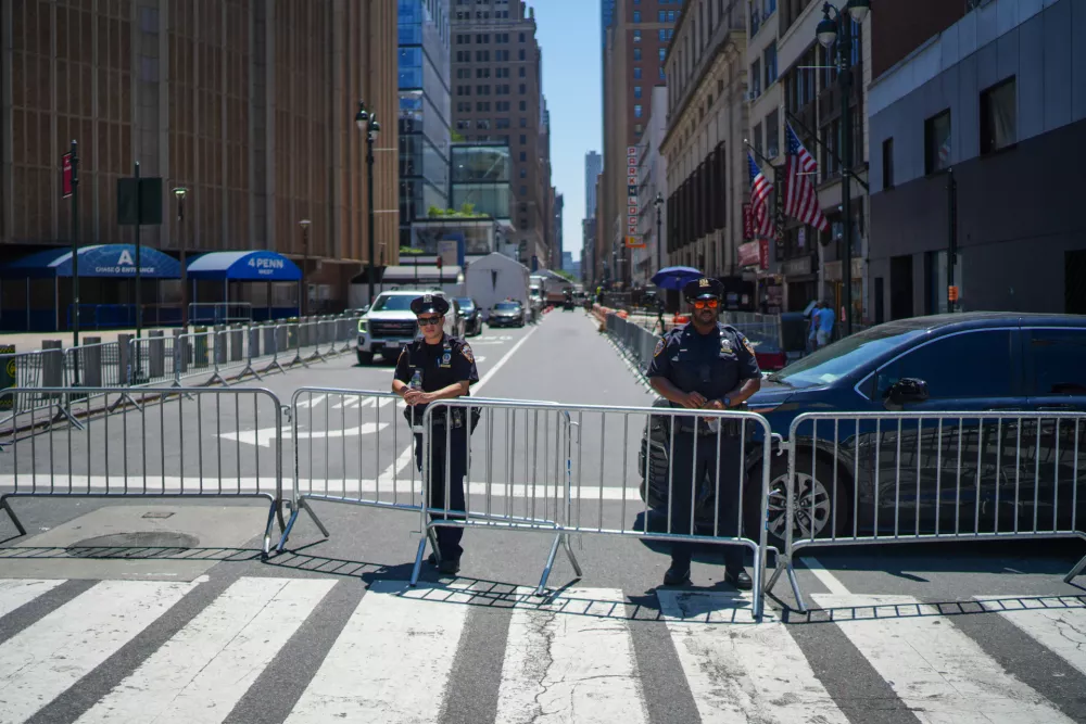 NYPD officers stand on a closed road next to Madison Square Garden ahead of a reported wedding between singer Taylor Swift and National Football League player Travis Kelce on Friday, July 3, 2026, in New York. (AP Photo/Ryan Murphy)