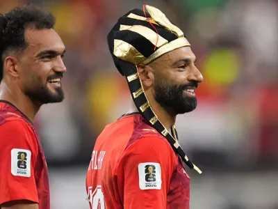 Egypt's Mohamed Salah, right, and teammate Mostafa Zico celebrate after winning a penalty shootout against Australia following a World Cup round of 32 soccer match in Arlington, Texas, near Dallas, Friday, July 3, 2026. (AP Photo/Julio Cortez)