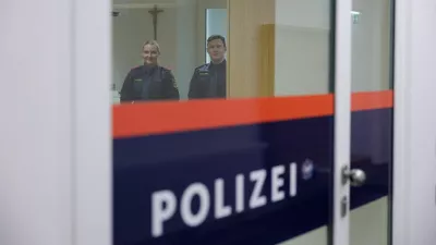 Police officers stand inside the building where Adolf Hitler was born, which has been converted into a police station by Austria's government in hopes of preventing it from serving as a place of pilgrimage for neo-Nazis, in Braunau am Inn, Austria, July 22, 2026. REUTERS/Gintare Karpaviciute