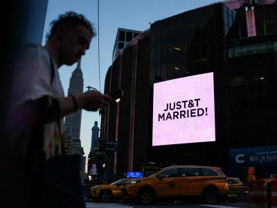 A screen displays a message referencing singer Taylor Swift and National Football League (NFL) player Travis Kelce outside Madison Square Garden, the venue for their reported wedding celebrations, in New York, U.S., July 3, 2026. REUTERS/Angelina Katsanis