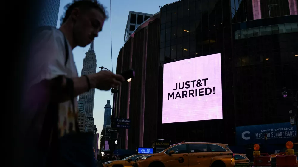 A screen displays a message referencing singer Taylor Swift and National Football League (NFL) player Travis Kelce outside Madison Square Garden, the venue for their reported wedding celebrations, in New York, U.S., July 3, 2026. REUTERS/Angelina Katsanis