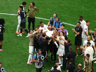 Soccer Football - FIFA World Cup 2026 - Round of 16 - Canada v Morocco - Houston Stadium, Houston, Texas, U.S. - July 4, 2026 Morocco players celebrate after the match as they qualify for the quarter final stage of the World Cup REUTERS/Issei Kato