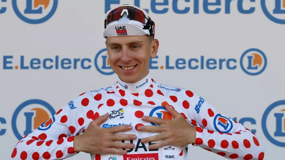 Cycling - Tour de France - Stage 1 - Barcelona to Barcelona - Barcelona, Spain - July 4, 2026 UAE Team Emirates XRG's Tadej Pogacar celebrates on the podium wearing the polka-dot jersey after stage 1 REUTERS/Gonzalo Fuentes