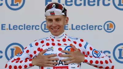 Cycling - Tour de France - Stage 1 - Barcelona to Barcelona - Barcelona, Spain - July 4, 2026 UAE Team Emirates XRG's Tadej Pogacar celebrates on the podium wearing the polka-dot jersey after stage 1 REUTERS/Gonzalo Fuentes