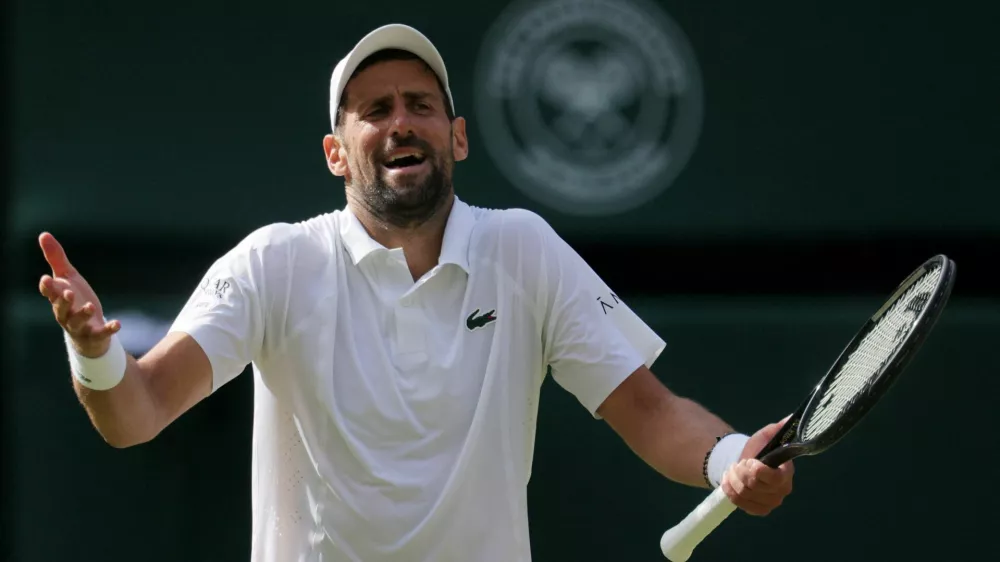 Tennis - Wimbledon - All England Lawn Tennis and Croquet Club, London, Britain - July 5, 2026 Serbia's Novak Djokovic reacts during his fourth round match against Russia's Roman Safiullin REUTERS/Marko Djurica