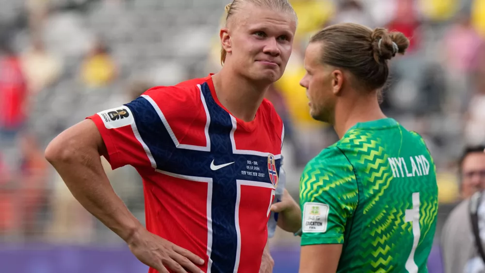 Norway's Erling Haaland (9) and Norway goalkeeper Oerjan Nyland (1) celebrate after the World Cup round of 16 soccer match between Brazil and Norway in East Rutherford, N.J., near New York, Sunday, July 5, 2026. (AP Photo/Frank Franklin II)