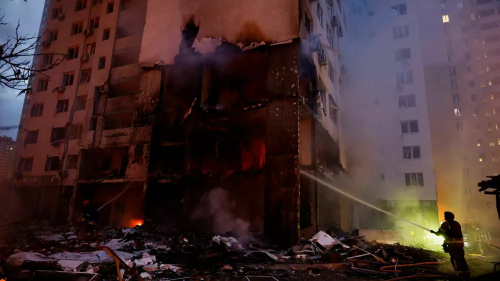 Firefighters work at the site of an apartment building, which was heavily damaged during Russian missile and drone strikes, amid Russia's attack on Ukraine, in Kyiv, Ukraine, July 6, 2026. REUTERS/Valentyn Ogirenko   TPX IMAGES OF THE DAY