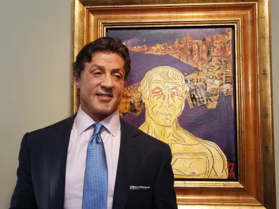 US Actor Sylvester Stallone, poses in front of one of his works during a press conference ahead of the exhibition "Sylvester Stallone. 35 Years of Painting" in the Gmurzynska gallery in St. Moritz, Switzerland, Thursday, Feb. 17, 2011. The retrospective which shows 30 pieces painted by the action star lasts from February 18 to March 15, 2011. (AP Photo/Keystone, Arno Balzarini)