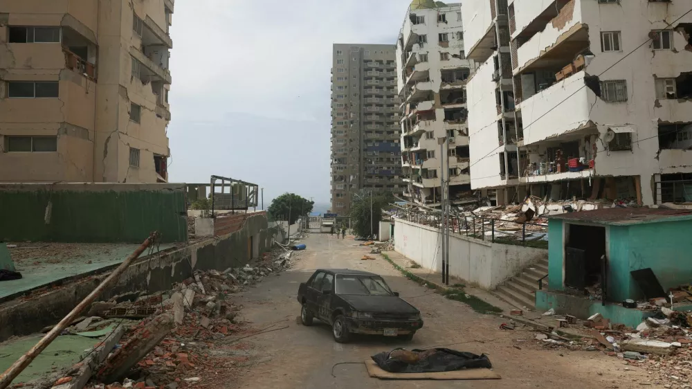 SENSITIVE MATERIAL. THIS IMAGE MAY OFFEND OR DISTURB  A body lies on the ground in the aftermath of the June 24 earthquakes, in La Guaira, Venezuela, July 5, 2026. REUTERS/Pablo Sanhueza   TPX IMAGES OF THE DAY