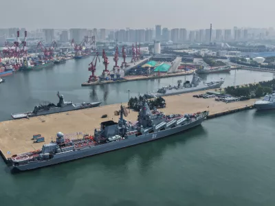 In this photo released by Xinhua News Agency, Russian naval fleets dock at a military port in Qingdao, east China's Shandong Province, to participate in the "Joint Sea-2026" naval exercise with China on Sunday, July 5, 2026. (Li Fengxiang/Xinhua via AP)