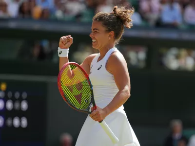 Jasmine Paolini of Italy celebrates winning the women's singles fourth round match against Alexandra Eala of the Philippines at the Wimbledon Tennis Championships in London, Monday, July 6, 2026.(AP Photo/Kirsty Wigglesworth)
