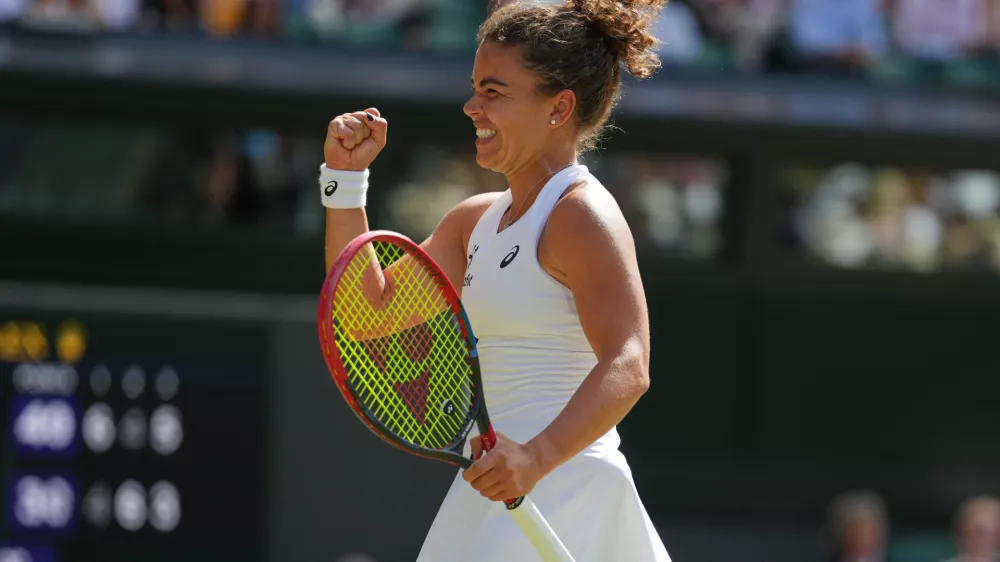 Jasmine Paolini of Italy celebrates winning the women's singles fourth round match against Alexandra Eala of the Philippines at the Wimbledon Tennis Championships in London, Monday, July 6, 2026.(AP Photo/Kirsty Wigglesworth)