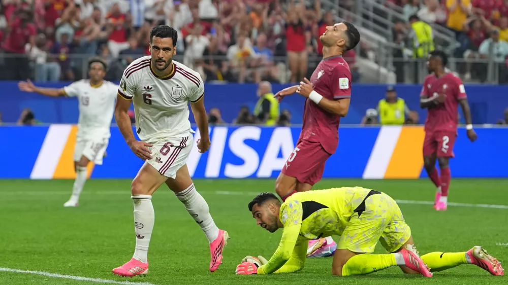Spain's Mikel Merino (6) celebrates scoring his side's opening goal during the World Cup round of 16 soccer match between Portugal and Spain in Arlington, Texas, near Dallas, Monday, July 6, 2026. (AP Photo/Julio Cortez)