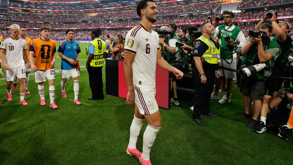Spain's scorer Mikel Merino (6)leaves the pitch after winning the World Cup round of 16 soccer match between Portugal and Spain in Arlington, Texas, near Dallas, Monday, July 6, 2026. (AP Photo/Tony Gutierrez)