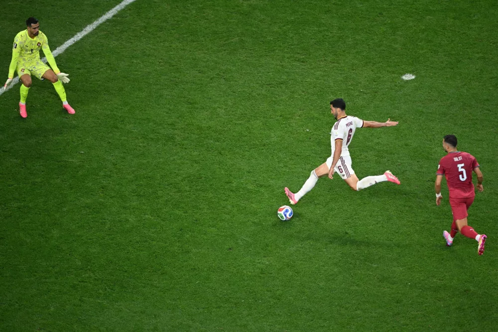 Spain's Mikel Merino (6) scores the opening goal in front of Portugal goalkeeper Diogo Costa (1) tries to stop him during the World Cup round of 16 soccer match between Portugal and Spain in Arlington, Texas, near Dallas, Monday, July 6, 2026. (AP Photo/Jessica Tobias)