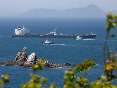 FILE PHOTO: Tugboats guide the crude oil tanker Odessa, carrying UAE crude after passing through the Strait of Hormuz with its Automatic Identification System transponder turned off, navigates the waters at Daesan port, where it is expected to discharge crude oil, in Seosan, South Korea, May 8, 2026. REUTERS/Kim Soo-hyeon/File Photo