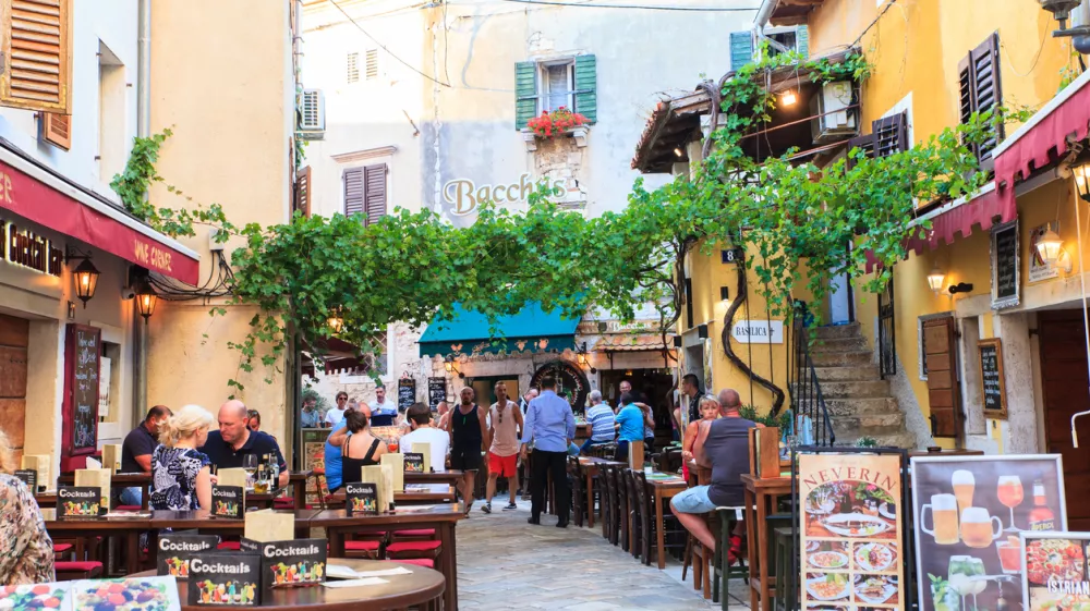Porec, Croatia - July, 14: View of restaurants, pubs and bars in the center town on July 14, 2017
