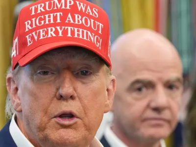 FILE - President Donald Trump speaks as FIFA President Gianni Infantino listens in the Oval Office of the White House, Friday, Aug. 22, 2025, in Washington. (AP Photo/Jacquelyn Martin, File)
