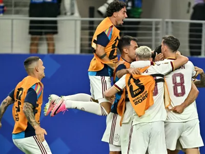 Soccer Football - FIFA World Cup 2026 - Round of 16 - Portugal v Spain - Dallas Stadium, Arlington, Texas, U.S. - July 6, 2026 Spain's Mikel Merino celebrates scoring their first goal with teammates IMAGN IMAGES via Reuters/Maria Lysaker
