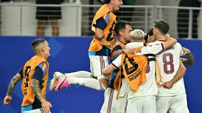Soccer Football - FIFA World Cup 2026 - Round of 16 - Portugal v Spain - Dallas Stadium, Arlington, Texas, U.S. - July 6, 2026 Spain's Mikel Merino celebrates scoring their first goal with teammates IMAGN IMAGES via Reuters/Maria Lysaker