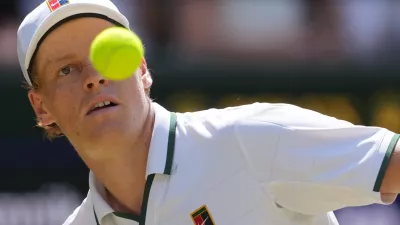 Jannik Sinner of Italy eyes the ball as he prepares to play a forehand against Jan-Lennard Struff of Germany in their quarter-final men's singles match at the Wimbledon Tennis Championships in London, Tuesday, July 7, 2026. (AP Photo/Kin Cheung)