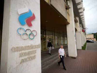 A man walks from the Russian National Olympic Committee building in Moscow, on Tuesday, July 7, 2026. (AP Photo/Pavel Bednyakov)