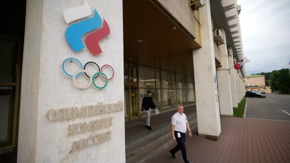 A man walks from the Russian National Olympic Committee building in Moscow, on Tuesday, July 7, 2026. (AP Photo/Pavel Bednyakov)