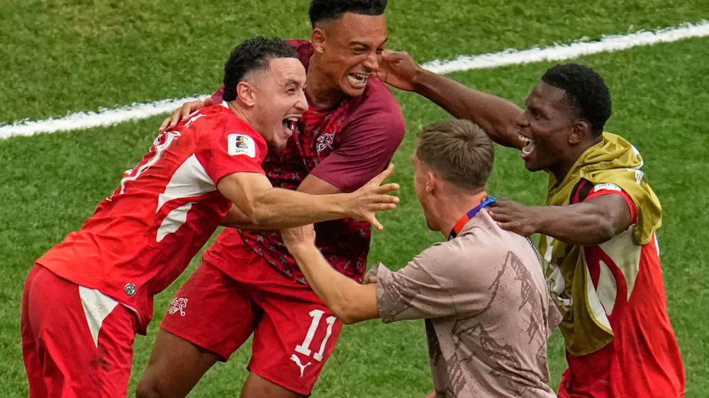 Switzerland's Ruben Vargas, left, reacts with teammates after scoring the winning shot in a shootout during the World Cup round of 16 soccer match in Vancouver, British Columbia, Tuesday, July 7, 2026. (AP Photo/Gregory Bull)