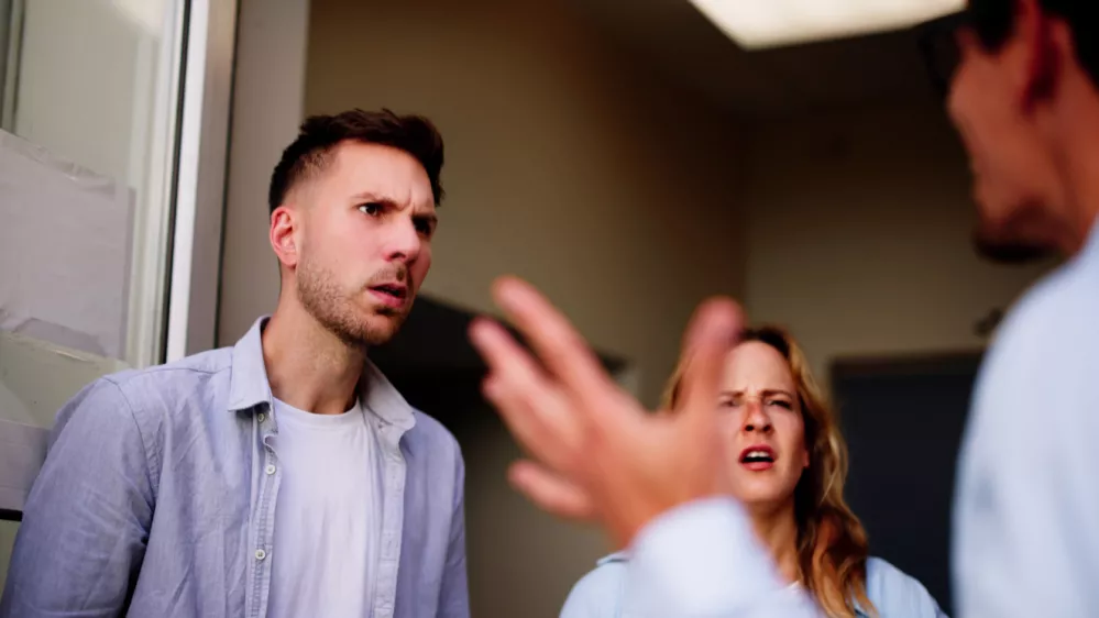Angry dispute interrupts young woman's peaceful visit, revealing tension between neighbors quarreling over a living situation.