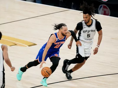 Jun 13, 2026; San Antonio, Texas, USA; New York Knicks guard Jalen Brunson (11) dribbles against San Antonio Spurs guard Stephon Castle (5) in the second half during game five of the 2026 NBA Finals at Frost Bank Center. Mandatory Credit: Dustin Safranek-Imagn Images