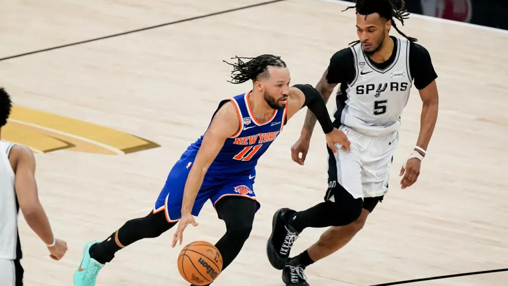 Jun 13, 2026; San Antonio, Texas, USA; New York Knicks guard Jalen Brunson (11) dribbles against San Antonio Spurs guard Stephon Castle (5) in the second half during game five of the 2026 NBA Finals at Frost Bank Center. Mandatory Credit: Dustin Safranek-Imagn Images