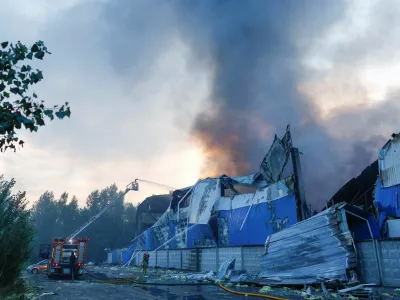 Firefighters work at the site of food and drink warehouses hit by an overnight Russian missile strike, amid Russia's attack on Ukraine, in Kyiv, Ukraine July 8, 2026. REUTERS/Valentyn Ogirenko