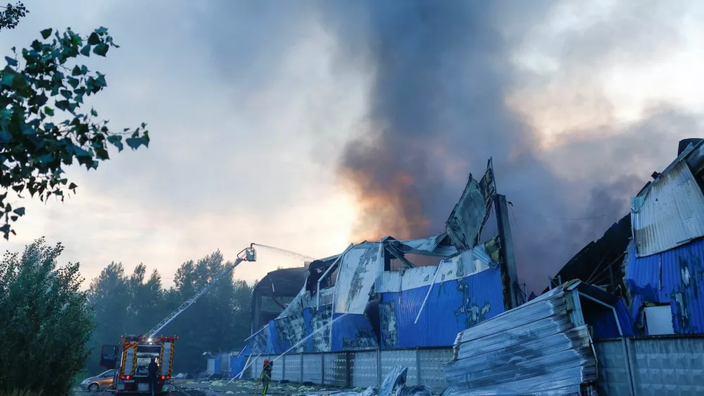 Firefighters work at the site of food and drink warehouses hit by an overnight Russian missile strike, amid Russia's attack on Ukraine, in Kyiv, Ukraine July 8, 2026. REUTERS/Valentyn Ogirenko