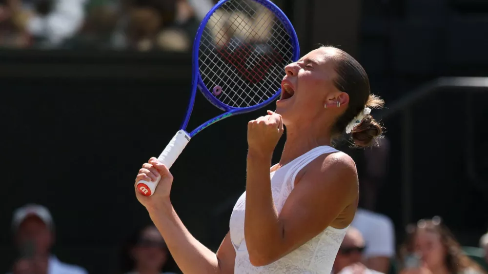 Tennis - Wimbledon - All England Lawn Tennis and Croquet Club, London, Britain - July 8, 2026 Ukraine's Marta Kostyuk celebrates after winning her quarter final match against Italy's Jasmine Paolini REUTERS/Marko Djurica