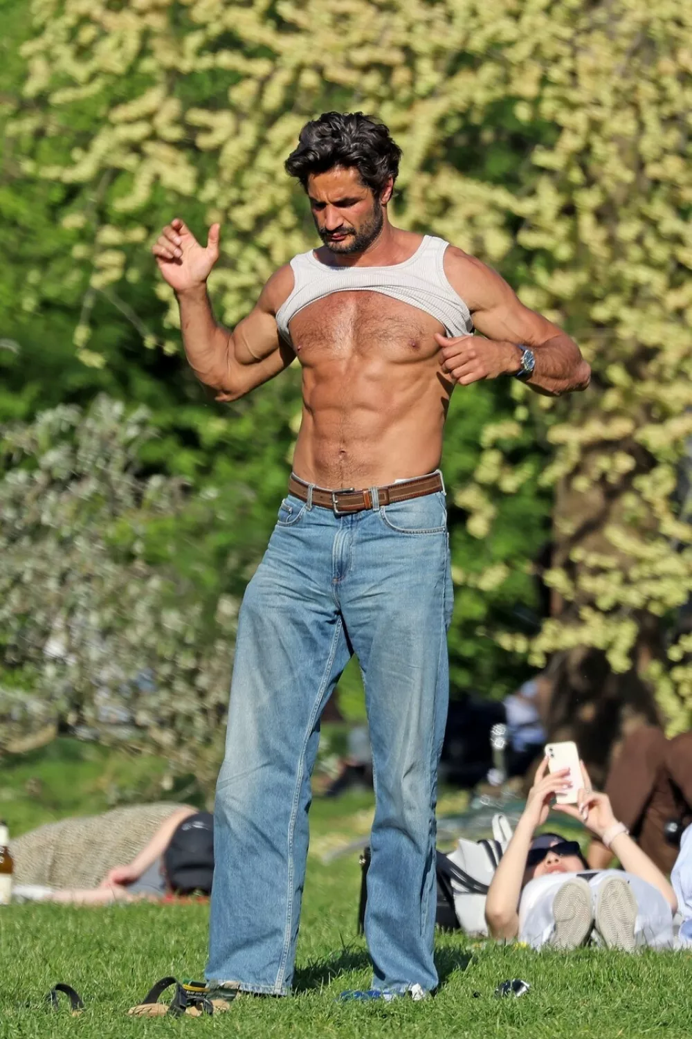 Milan, ITALY - *EXCLUSIVE* - English model Guy Binns, former boyfriend of Eiza Gonz&aacute;lez, was spotted enjoying a sunny afternoon at the park, shirtless and showcasing his impressive six-pack as he soaked up the rays and relaxed in the warmth of the day.*Pictures Containing Children Please Pixelate Face Prior To Publication*,Image: 996977095, License: Rights-managed, Restrictions: RIGHTS: WORLDWIDE EXCEPT IN ITALY, Model Release: no, Pictured: Guy Binns 