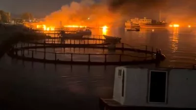 Smoke rises from a port, near Strait of Hormuz, following a U.S. strike in Kuhestak, Hormozgan Province, Iran, July 8, 2026, in this screengrab obtained from a social media video. Social Media/via REUTERS THIS IMAGE HAS BEEN SUPPLIED BY A THIRD PARTY. MANDATORY CREDIT. NO RESALES. NO ARCHIVES. NEWS USE ONLY. Verification line: Reuters confirmed the location by matching the port layout visible in the video with satellite imagery. The coordinates are 26.801109802855272, 57.02121784040872. The date the video was filmed was verified through a report from Iran's semi-official Mehr News Agency, which reported explosions early on July 8 at multiple locations along the Gulf coast, including Kuhestak. Aftermath photographs shared online on July 8 also showed damage at the same location. No earlier versions of the footage or photographs posted before July 8 were found.