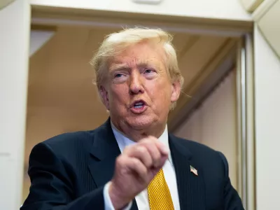 President Donald Trump speaks with reporters in flight on Air Force One after landing at U.S. Air Force Base at RAF Mildenhall, in Suffolk, Eastern England, Wednesday, July 8, 2026. (AP Photo/Alex Brandon)