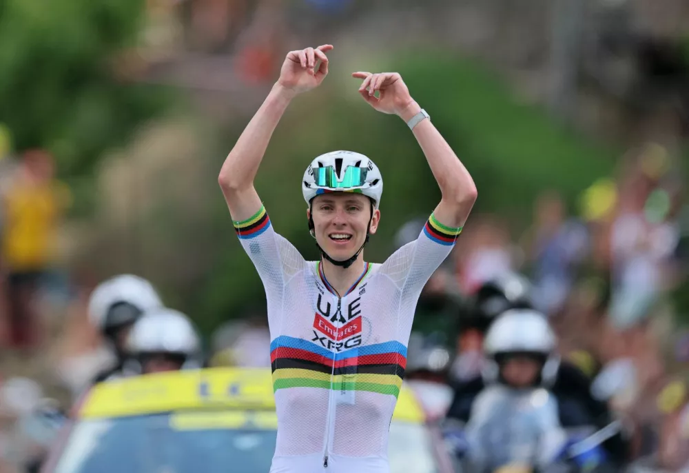 Cycling - Tour de France - Stage 6 - Pau to Gavarnie-Gedre - Pau, France - July 9, 2026 UAE Team Emirates XRG's Tadej Pogacar celebrates after crossing the finish line to win stage 6 REUTERS/Gonzalo Fuentes