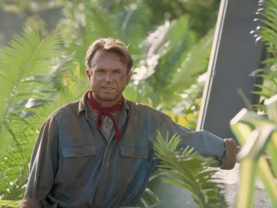 Actor Sam Neill as Dr. Alan Grant, standing next to an electric fence in a scene from the film 'Jurassic Park', 1993. (Photo by Murray Close/Getty Images)