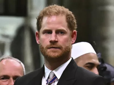 FILE - Britain's Prince Harry, Duke of Sussex looks on as Britain's King Charles III leaves Westminster Abbey after coronation in central London Saturday, May 6, 2023. Prince Harry has spoken to King Charles III about his cancer diagnosis and "will be traveling to the U.K. to see His Majesty in the coming days," said the office of Harry and his wife, Meghan. (Ben Stansall/Pool photo via AP, File)