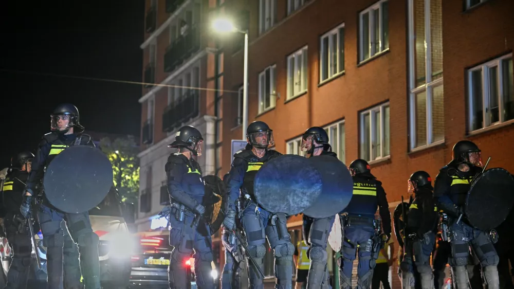 Dutch riot police deploys as Morocco fans gather after the World Cup quarterfinal soccer match between France and Morocco in The Hague, Netherlands, Friday, July 10, 2026. (AP Photo/Mouneb Taim)