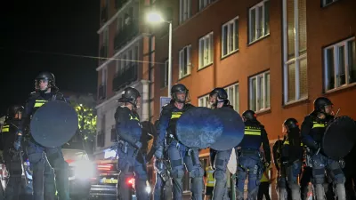 Dutch riot police deploys as Morocco fans gather after the World Cup quarterfinal soccer match between France and Morocco in The Hague, Netherlands, Friday, July 10, 2026. (AP Photo/Mouneb Taim)
