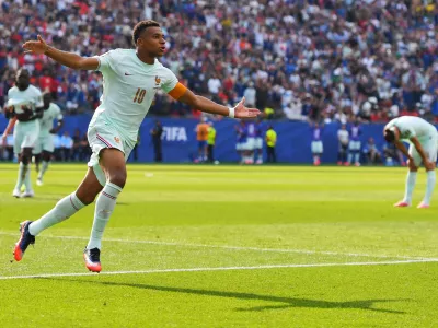 France's Kylian Mbappe (10) celebrates scoring the opening goal during the World Cup quarterfinal soccer match between France and Morocco in Foxborough, Mass., near Boston, Thursday, July 9, 2026. (AP Photo/Steven Senne)