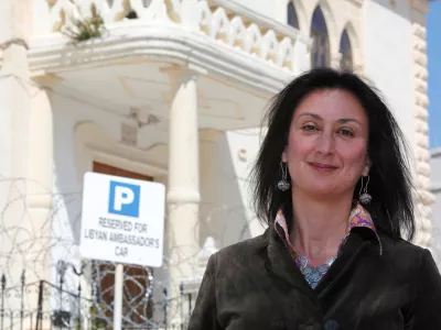 Maltese investigative journalist Daphne Caruana Galizia poses outside the Libyan Embassy in Valletta April 6, 2011. Investigative journalist Caruana Galizia was killed after a powerful bomb blew up a car killing her in Bidnija, Malta, in October 16, 2017. Picture taken April 6, 2011. REUTERS/Darrin Zammit Lupi - RC11D8CC39E0
