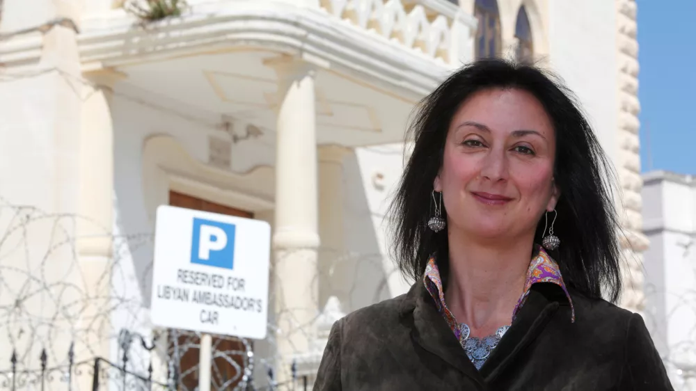 Maltese investigative journalist Daphne Caruana Galizia poses outside the Libyan Embassy in Valletta April 6, 2011. Investigative journalist Caruana Galizia was killed after a powerful bomb blew up a car killing her in Bidnija, Malta, in October 16, 2017. Picture taken April 6, 2011. REUTERS/Darrin Zammit Lupi - RC11D8CC39E0