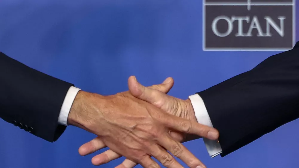 NATO Secretary General Mark Rutte and U.S. President Donald Trump shake hands as Trump arrives ahead of a family photo at a NATO leaders' summit in Ankara, Turkey, July 8, 2026. REUTERS/Stoyan Nenov   TPX IMAGES OF THE DAY